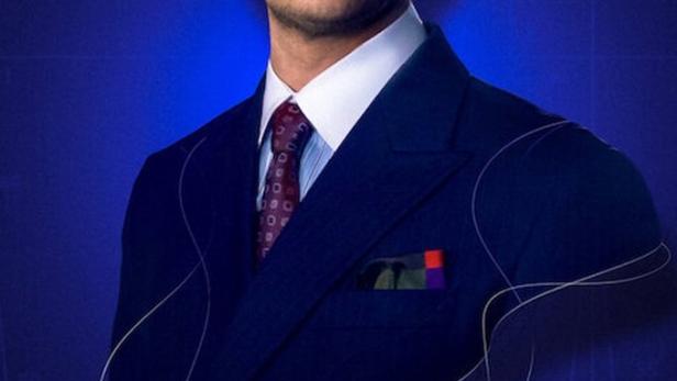 Ein Mann im Anzug vor einem blauen Hintergrund mit dem Titel „Der Schneider“.