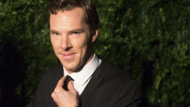 British actor Cumberbatch adjusts his tie at the E
