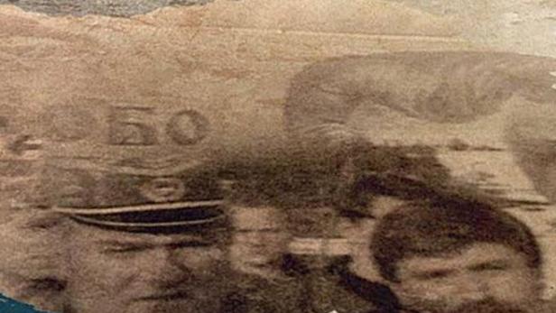 Das Cover des Buches „Balkan in Flammen“ zeigt historische Porträts vor einer zerstörten Landschaft.