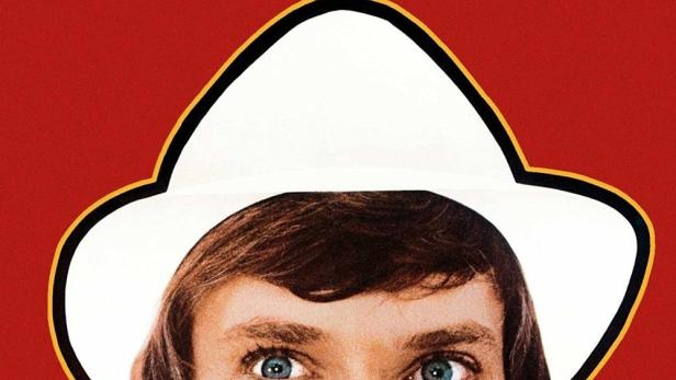 Das Filmplakat für „O Lucky Man!“ zeigt Malcolm McDowell mit Hut vor rotem Hintergrund.