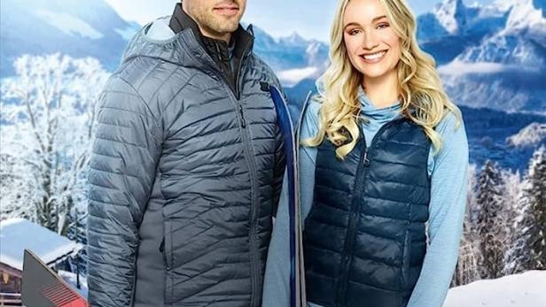 Das Filmplakat für „Liebe auf der Piste“ mit Thomas Beaudoin und Katrina Bowden vor einer verschneiten Bergkulisse.
