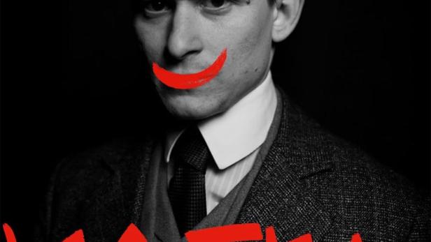 Ein Porträt von Franz Kafka mit einem aufgemalten roten Grinsen und dem Schriftzug „Kafka“.
