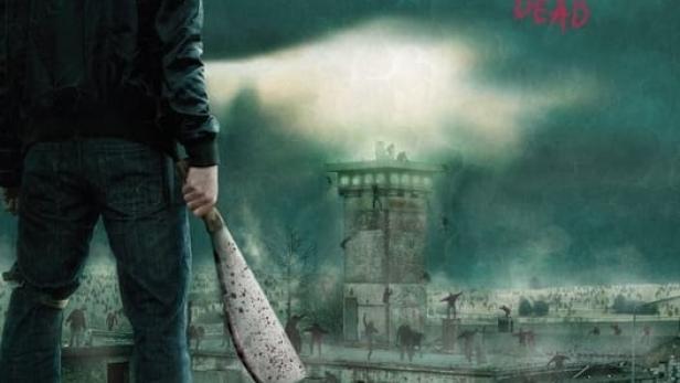 Ein Mann mit einer Machete steht vor einer Festung, die von Zombies umgeben ist, auf dem Filmplakat zu „Extinction“.