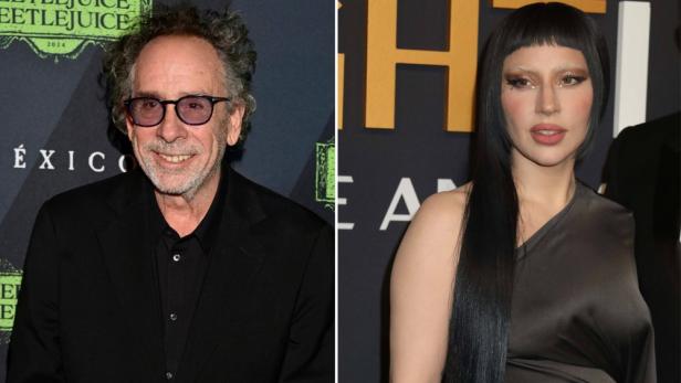 Tim Burton und Lady Gaga posieren zusammen auf einem Event.