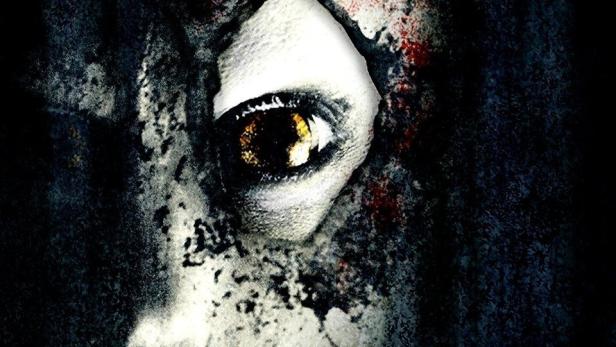 Das verstörende Gesicht einer Person mit dem Titel „Kiss the Abyss“ darüber.