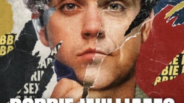 Ein zerrissenes Poster mit dem Gesicht von Robbie Williams.