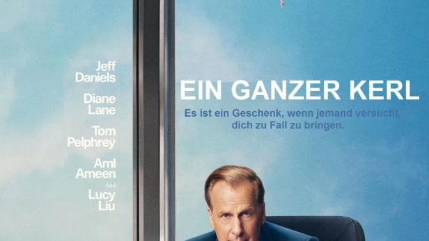 Das Filmplakat für „Ein ganzer Kerl“ zeigt Jeff Daniels vor einer Skyline, die auf dem Kopf steht.
