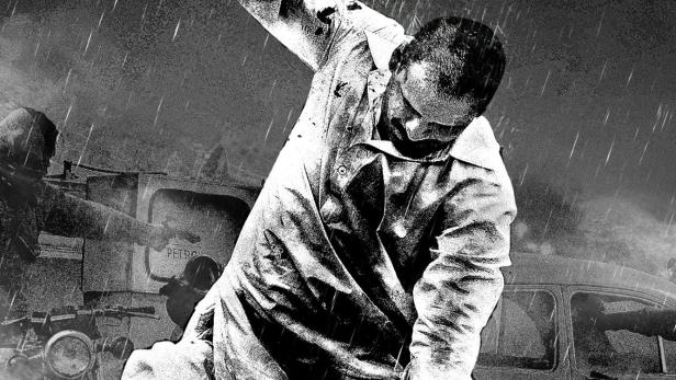 Ein Mann schlägt mit einer Axt auf eine am Boden liegende Person im Filmplakat zu „Asian Godfather: Die Gangs von Wasseypur Teil 2“.