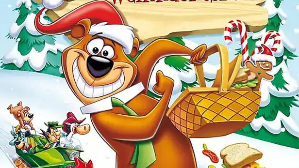 Das Cover von „Yogi Bärs Große Weihnachtsfeier“ zeigt Yogi mit Weihnachtsmütze und Picknickkorb.