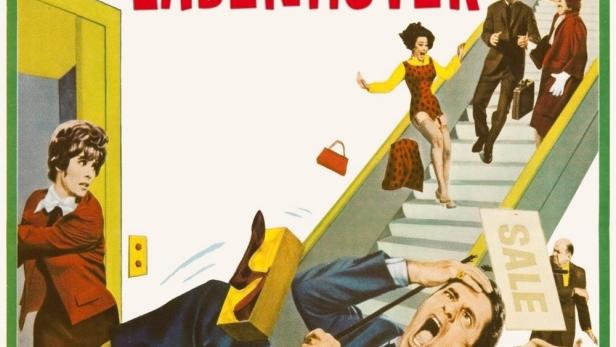 Das Filmplakat für „Der Ladenhüter“ mit Jerry Lewis, der von einer Rolltreppe stürzt.