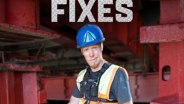 Ein Bauarbeiter mit Schutzhelm und Sicherheitsweste vor roter Stahlkonstruktion für die National Geographic Serie „World's Toughest Fixes“.
