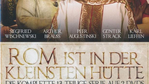 Das DVD-Cover der 13-teiligen Serie „Rom ist in der kleinsten Hütte“ mit den Schauspielern Siegfried Wischnewski und Arthur Brauss.