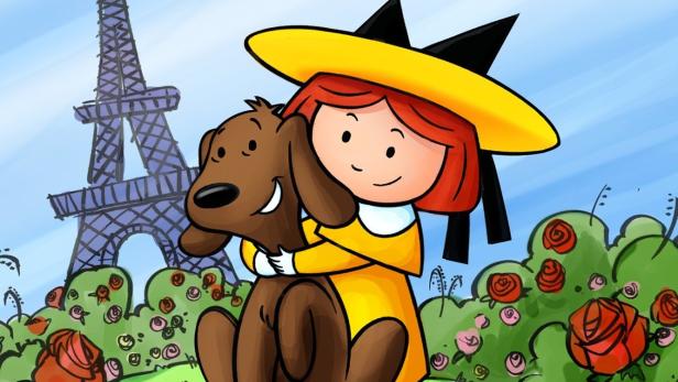 Madeline umarmt einen Hund vor dem Eiffelturm in Paris.