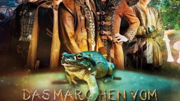 Das Filmplakat zu „Das Märchen vom Frosch und der goldenen Kugel“ zeigt einen Frosch und mehrere Schauspieler.