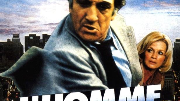 Das Filmplakat für „L'Homme en colère“ zeigt einen Mann und eine Frau vor einer Stadtkulisse.