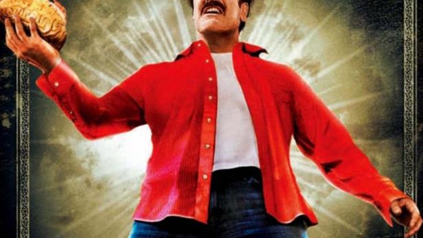 Ein Mann hält ein brennendes Gehirn in der Hand, im Hintergrund der Filmtitel „Man with the Screaming Brain“.