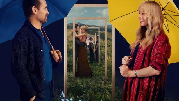 Das Filmplakat für „A Big Bold Beautiful Journey“ zeigt Colin Farrell und Mackenzie Davis mit Regenschirmen vor einer surrealen Landschaft.