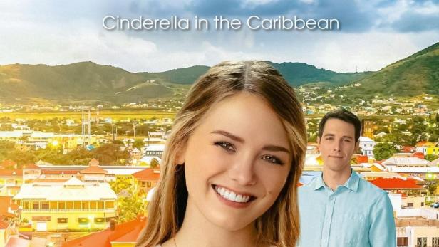 Das Filmplakat für „Ein karibisches Märchen“ zeigt Emma Reingel und Conor McGee vor einer karibischen Stadt.