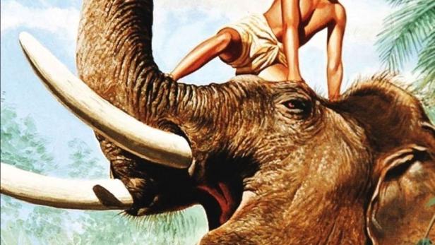 Ein Junge reitet auf einem Elefanten, wie auf dem Filmplakat zu „Der Elefantenjunge“.