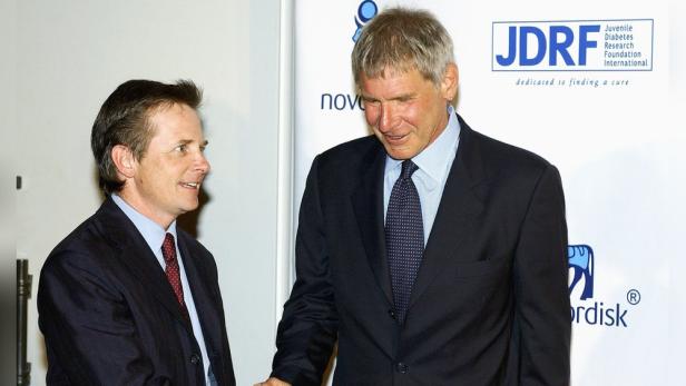Michael J. Fox und Harrison Ford bei einem Pressetermin