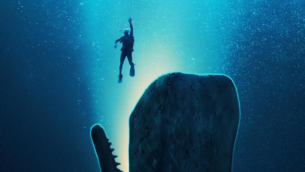 Ein Taucher schwimmt im tiefblauen Wasser über einem riesigen Pottwal, unter dem der Schriftzug „WHALEFALL“ zu sehen ist.