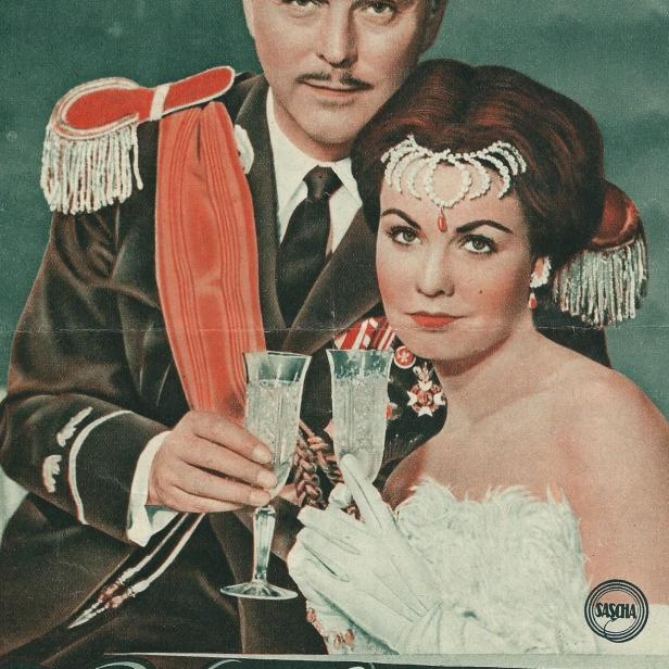 Ein Filmposter für „Wien, du Stadt meiner Träume“ mit einem Paar, das mit Sekt anstößt.