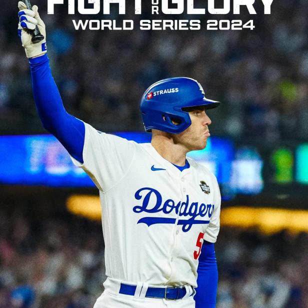 Ein Baseballspieler der Los Angeles Dodgers feiert mit erhobenem Schläger den Gewinn der World Series 2024.