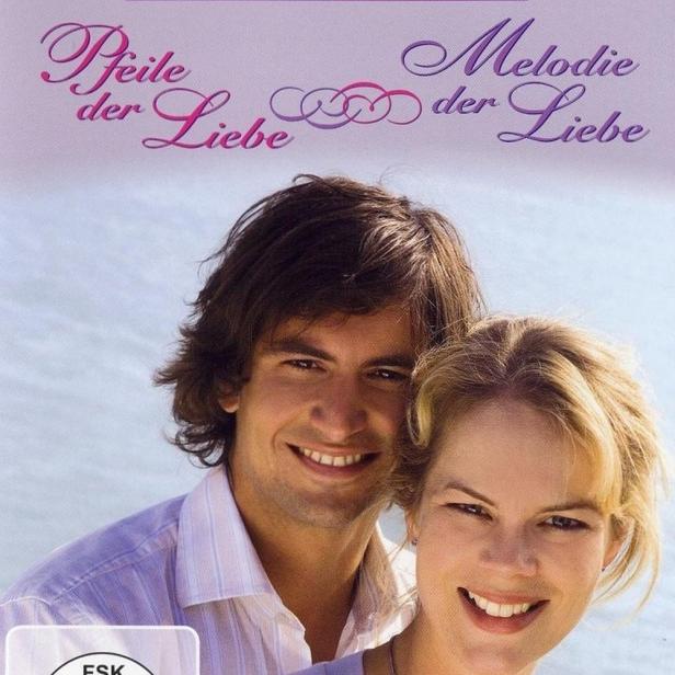 Das Cover der Rosamunde Pilcher Collection „Pfeile der Liebe / Melodie der Liebe“ zeigt ein lächelndes Paar.